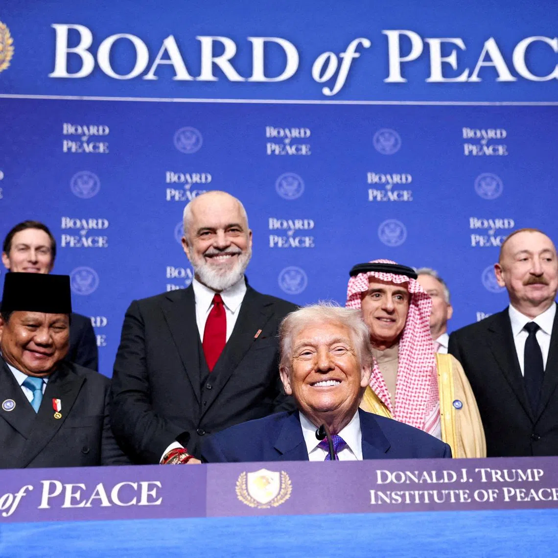 FILE PHOTO: U.S President Donald Trump, Indonesia's President Prabowo Subianto, Albania's Prime Minister Edi Rama, Saudi Minister of State for Foreign Affairs, Cabinet Member, and Climate Envoy Adel Al-Jubeir, Azerbaijani President Ilham Aliyev, and Jordan's Foreign Minister Ayman Safadi attend the inaugural Board of Peace meeting at the U.S. Institute of Peace in Washington, D.C., U.S., February 19, 2026. REUTERS/Kevin Lamarque//File Photo