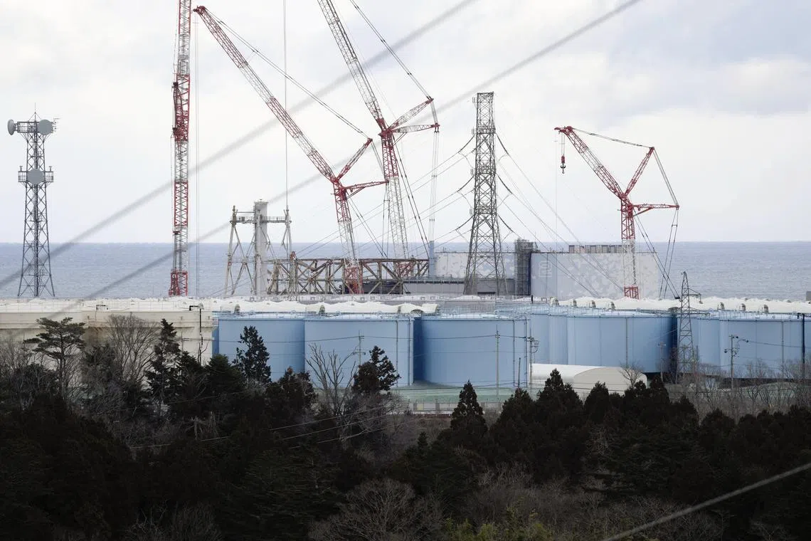 Reactor houses at TEPCO's Fukushima Daiichi Nuclear Power Plant are seen over storage tanks of decontaminated water in Okuma, Fukushima Prefecture northern Japan, on Feb 14.