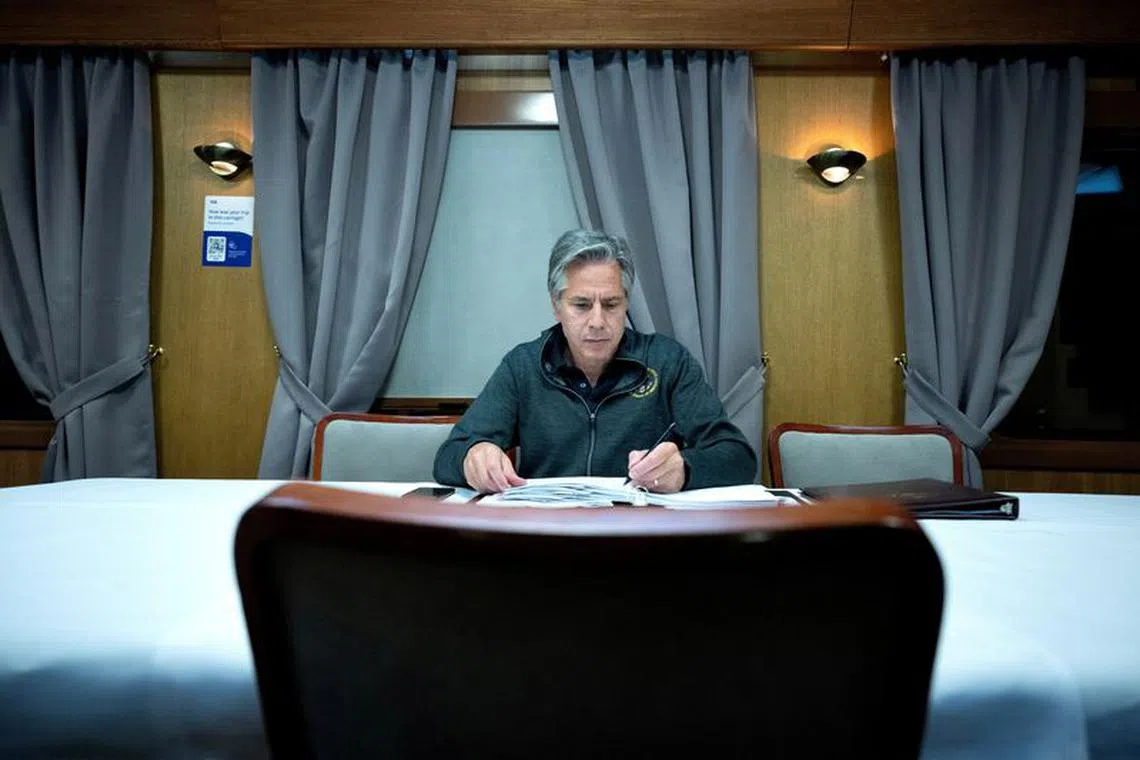 U.S. Secretary of State Antony Blinken works while traveling by train to Kyiv, Ukraine at an undisclosed location, September 6, 2023.     Brendan Smialowski/Pool via REUTERS