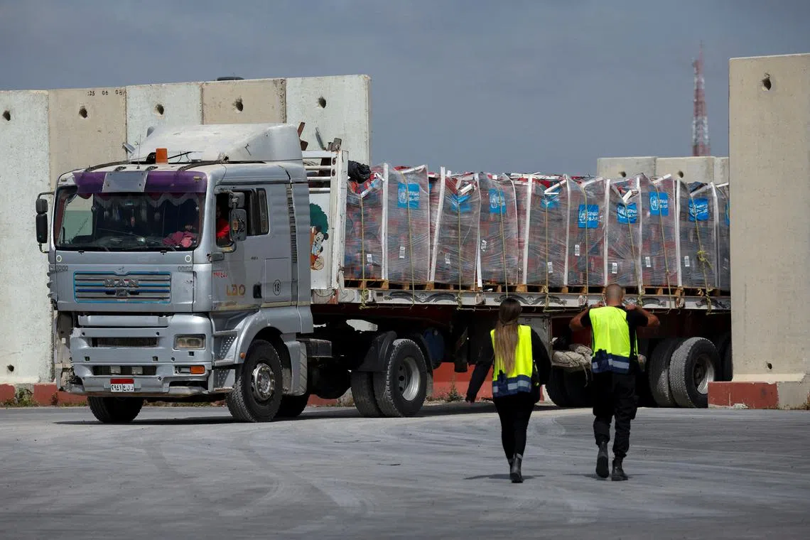 A truck carrying humanitarian aid bound for the Gaza Strip drives at the inspection area at the Kerem Shalom crossing, amid the ongoing conflict between Israel and the Palestinian Islamist group Hamas, in southern Israel, March 14, 2024. REUTERS/Carlos Garcia Rawlins/File Photo