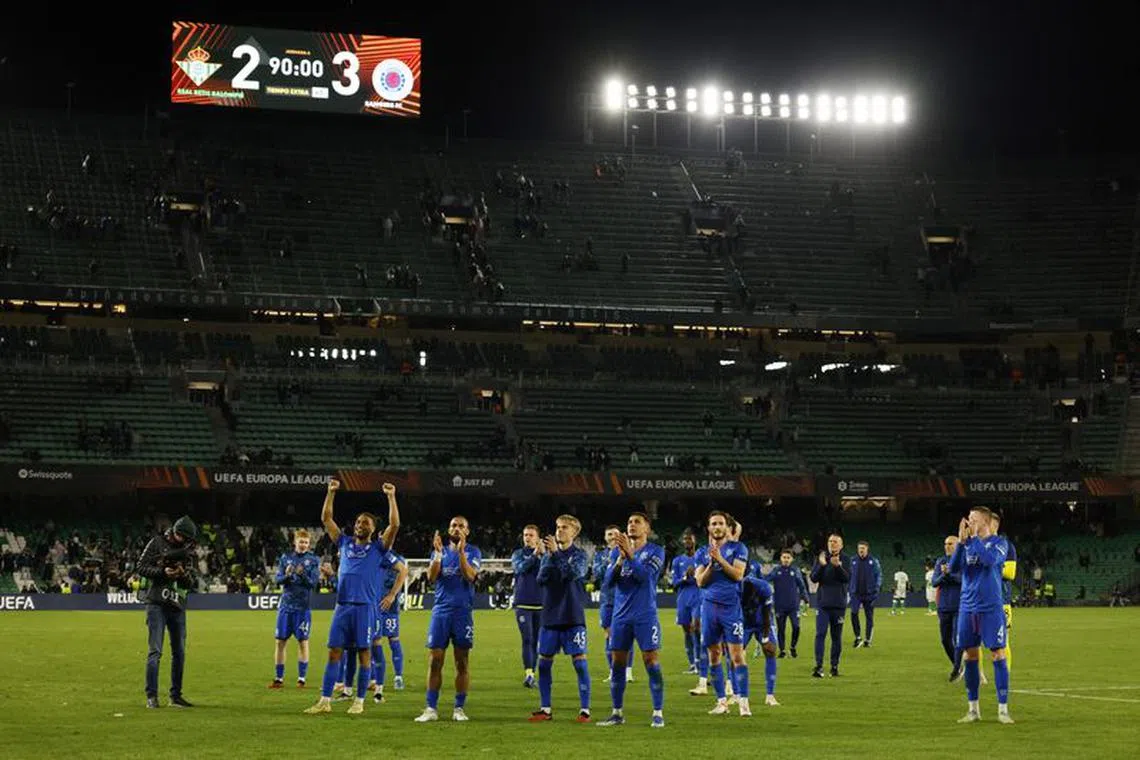 Soccer Football - Europa League - Group C - Real Betis v Rangers - Estadio Benito Villamarin, Seville, Spain - December 14, 2023  Rangers' Cyriel Dessers, Kemar Roofe, James Tavernier and Ross McCausland celebrate after the match REUTERS/Marcelo Del Pozo/File Photo