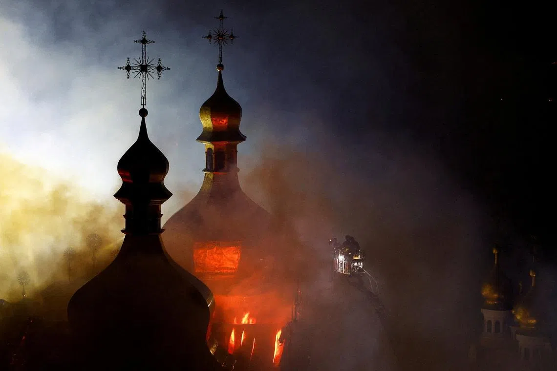 Firefighters working to extinguish a fire at the Dormition Cathedral of the Kyiv Pechersk Lavra, amid Russia's attack on Ukraine, in Kyiv, Ukraine, on June 15, 2026. 