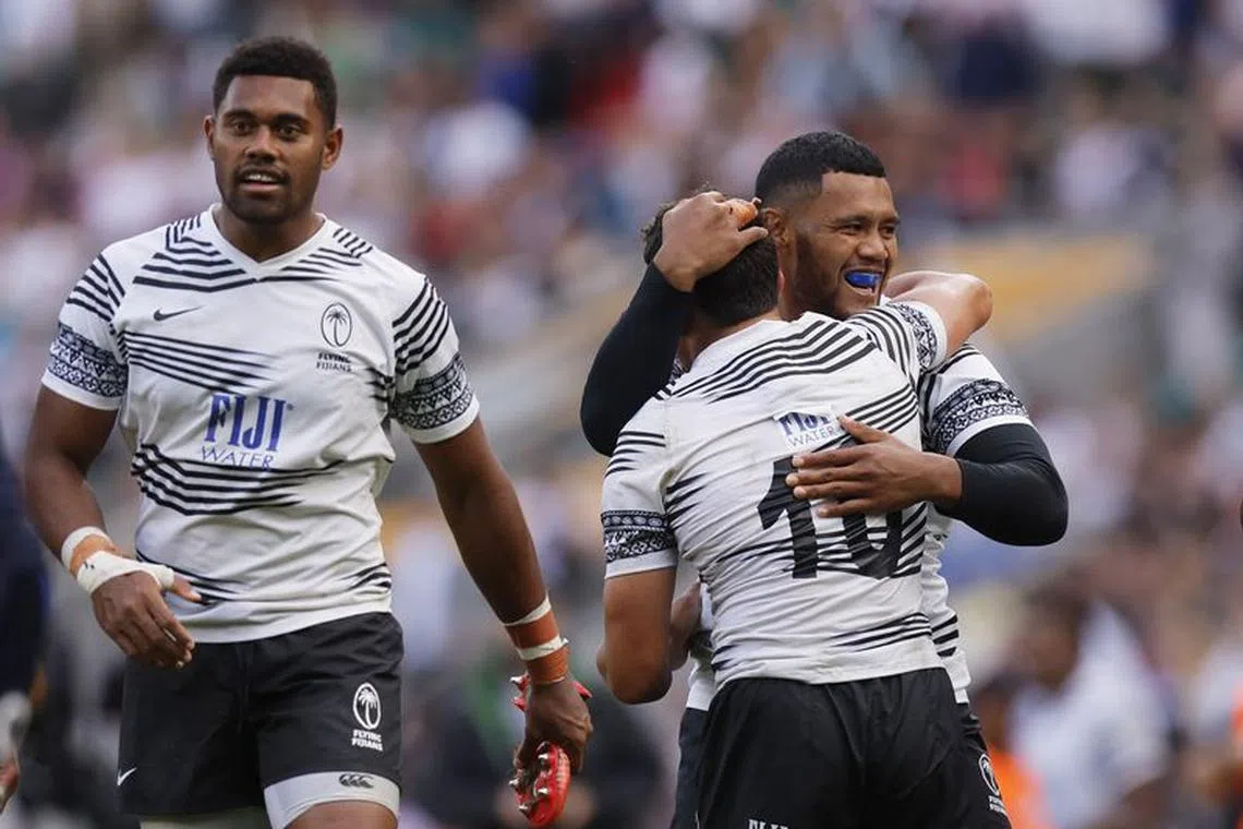 FILE PHOTO: Rugby Union -  England v Fiji - World Cup Warm Up - Twickenham Stadium, London, Britain - August 26, 2023 Fiji's Caleb Muntz and teammates celebrate after the match Action Images via Reuters/Andrew Couldridge/File Photo