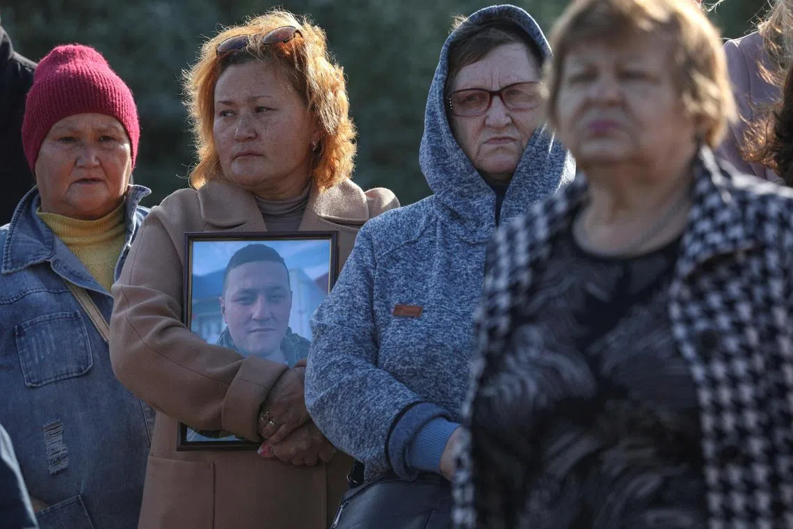 People attend a tree planting ceremony in memory of fallen Russian service members, who were killed in the course of Russia-Ukraine military conflict, in Sevastopol, Crimea, November 20, 2022. REUTERS/Alexey Pavlishak     TPX IMAGES OF THE DAY     