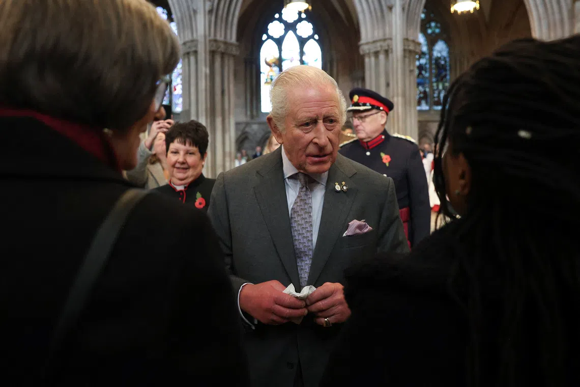 Britain’s King Charles looks on as he meets community groups during his visit at Lichfield Cathedral, with a focus on the Fenland Black Oak Table, The Table for the Nation, in Lichfield, Staffordshire, Britain October 27, 2025. REUTERS/Temilade Adelaja/Pool