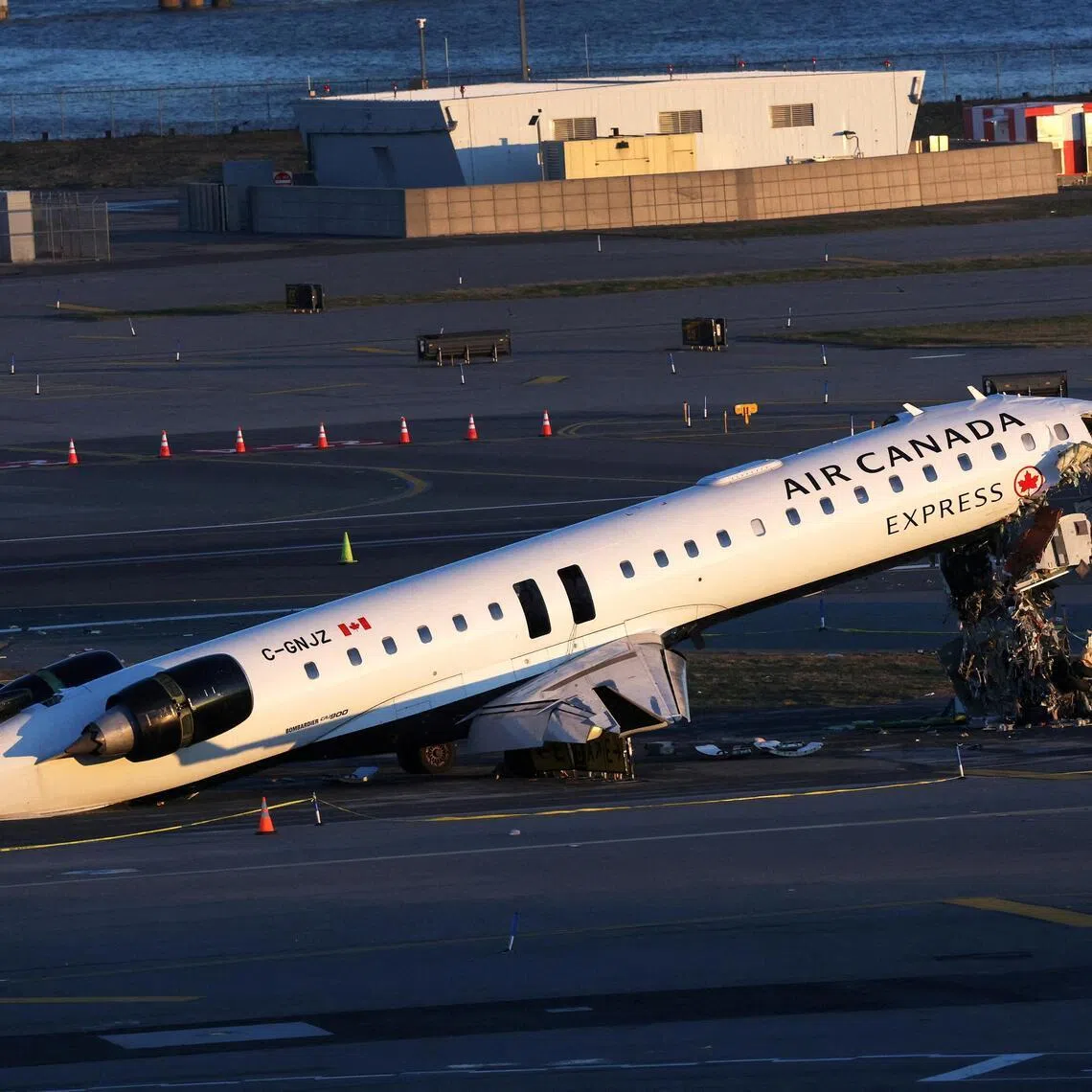 The wreckage of an Air Canada Express jet that collided with a ground vehicle at New York's LaGuardia Airport.