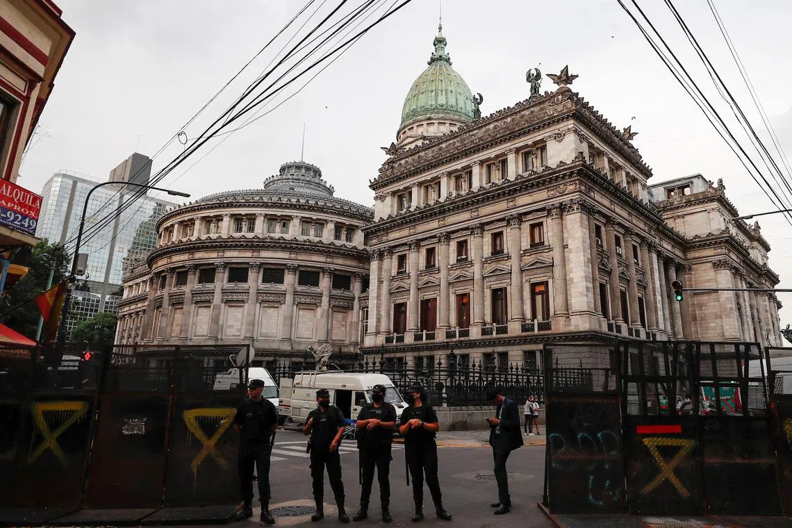 FILE PHOTO: Police officers stand in front of the National Congress in Buenos Aires, Argentina March 17, 2022. REUTERS/Agustin Marcarian/File Photo