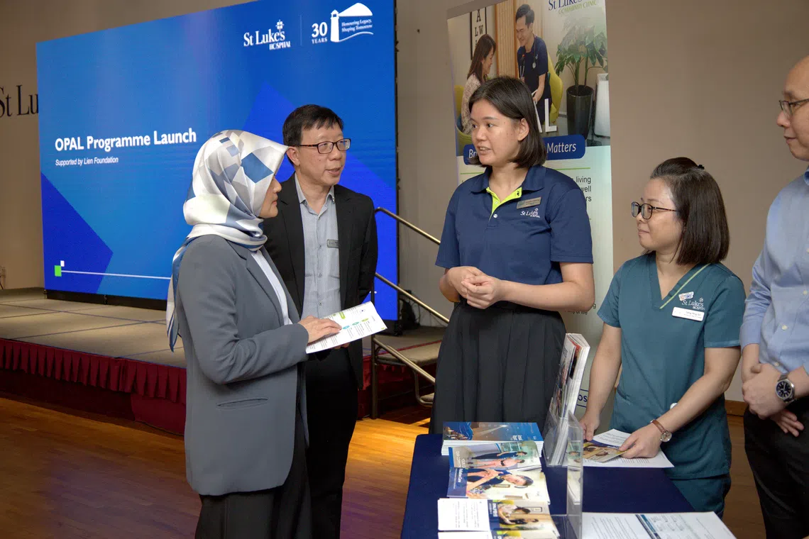 St Luke’s Hospital CEO Tan Boon Yeow (second from left) and Minister of State for Health Madam Rahayu Mahzam (left) at the Oct 27 launch of Opal, a primary palliative care programme that the community hospital co-developed with the Lien Foundation.  