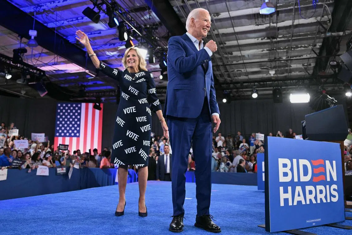 US President Joe Biden and First Lady Jill Biden walk off the stage after a campaign event in Raleigh, North Carolina, on June 28, 2024. (Photo by Mandel NGAN / AFP)