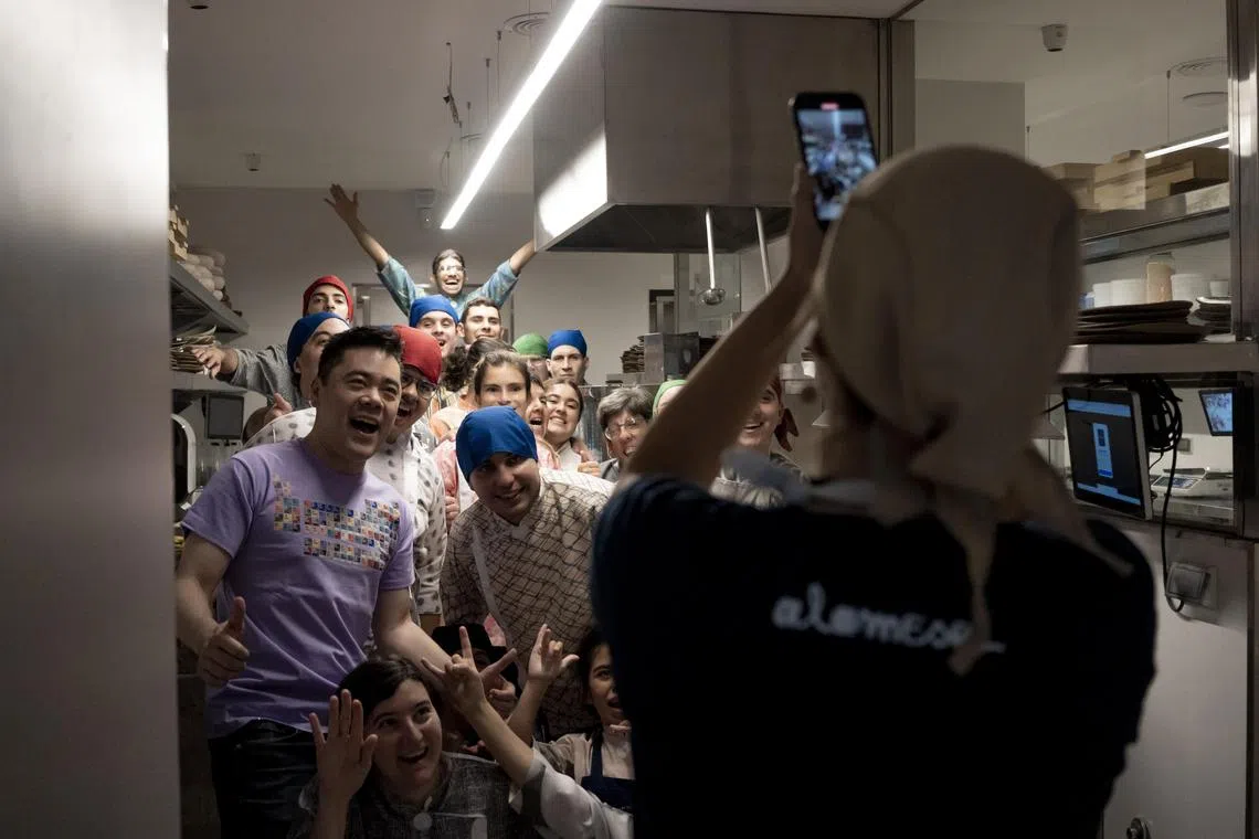 Staff take a photo at Alamesa restaurant in Buenos Aires, Argentina on March 1, 2024. 