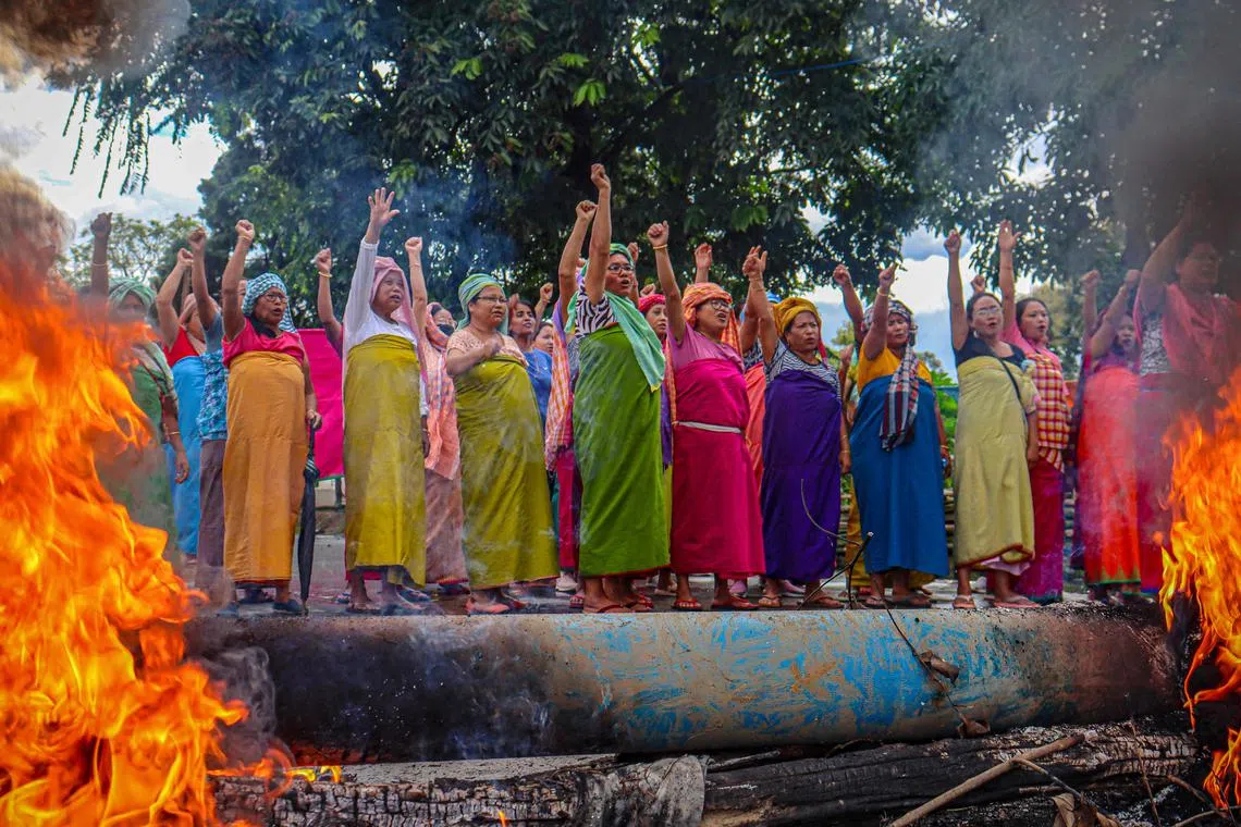 Women protesters shouting slogans during 48-hour general strike in Imphal, India on Sept 19, as they demand restoration of peace in India's northeastern state of Manipur after ethnic violence. 