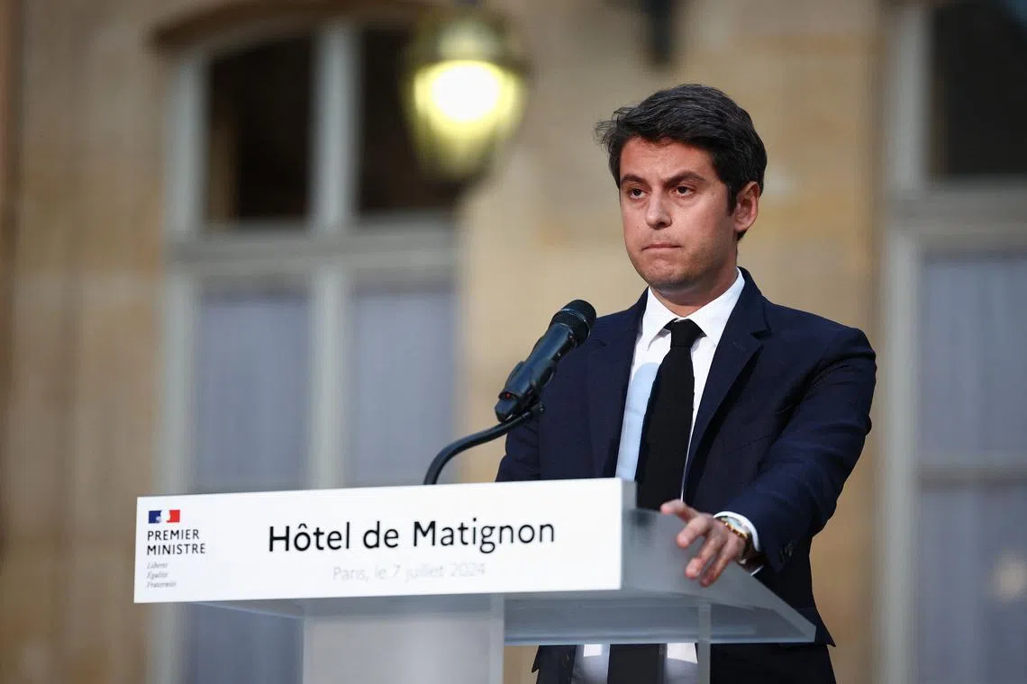 Gabriel Attal, French Prime Minister and French presidential majority group \"Ensemble pour la Republique\" candidate, delivers a speech after partial results in the second round of the early French parliamentary elections, at Hotel Matignon in Paris in Paris, France, July 7, 2024. REUTERS/Guglielmo Mangiapane