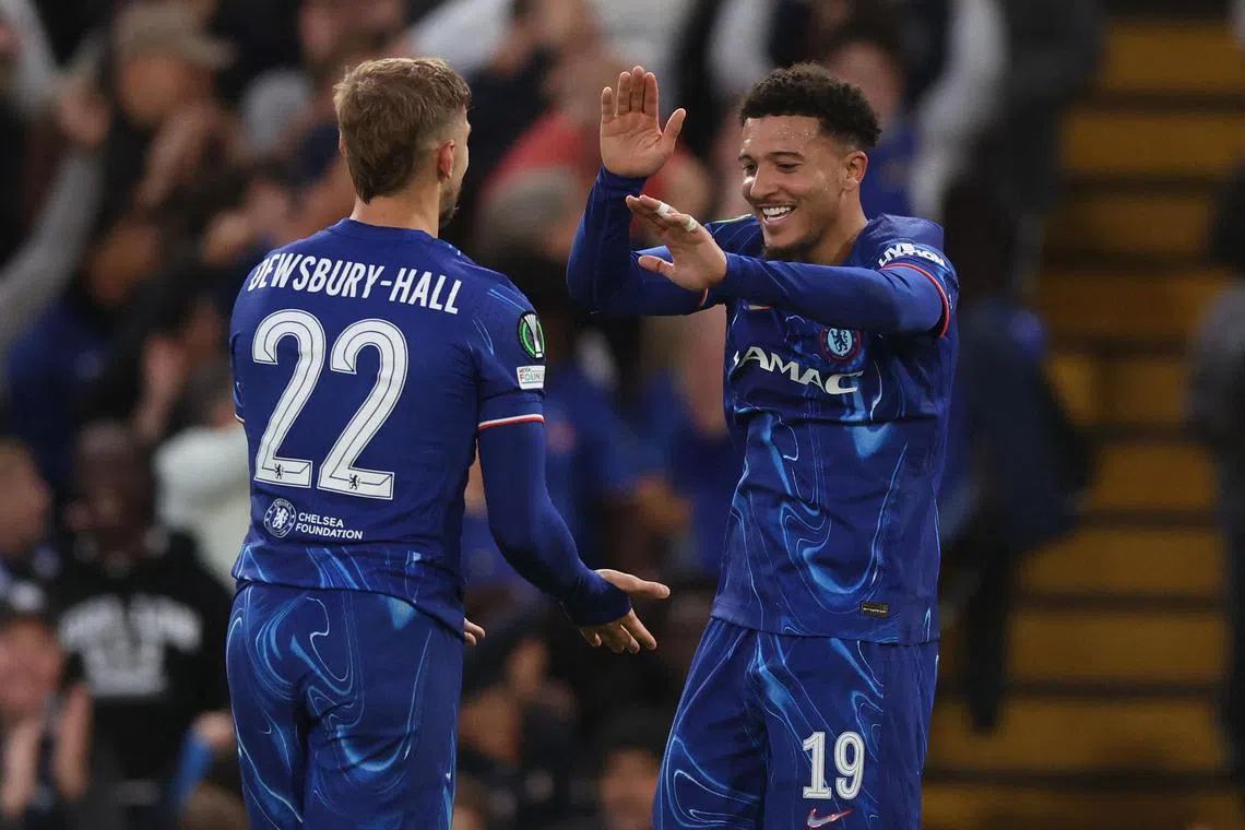 Chelsea's Kiernan Dewsbury-Hall celebrates scoring their first goal with Chelsea's Jadon Sancho.