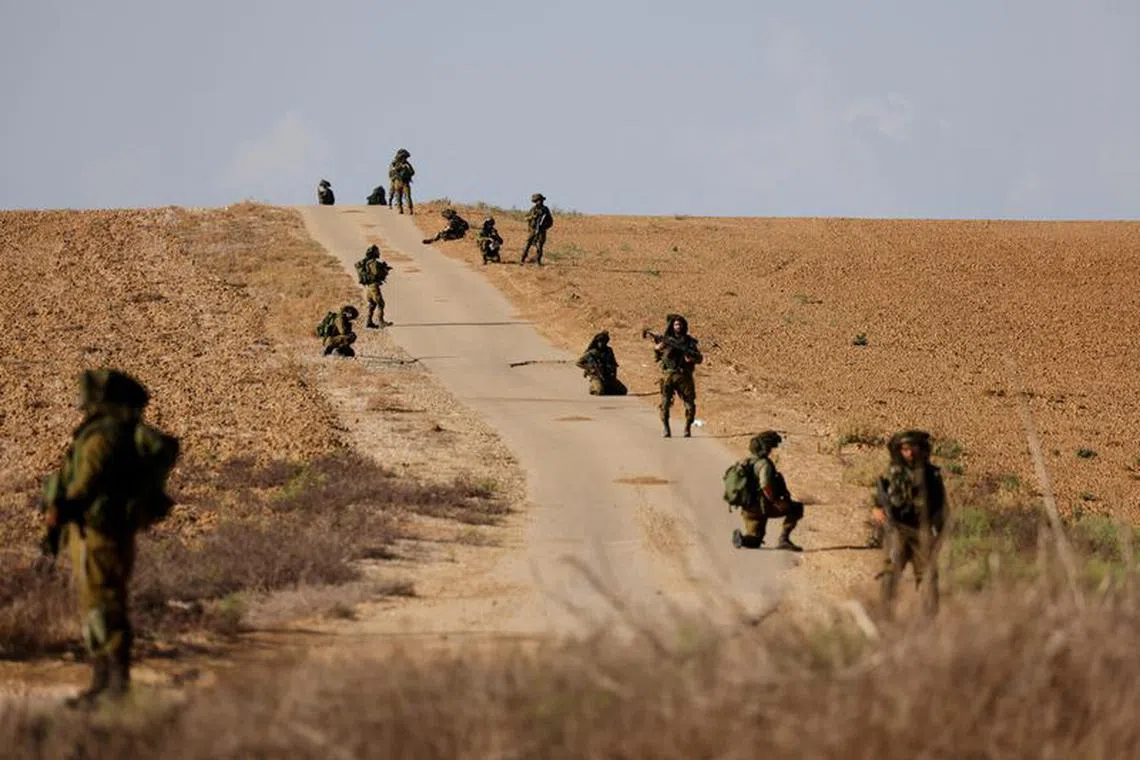 Israeli soldiers patrol an area near Israel's border with the Gaza Strip, in southern Israel  October 19, 2023. REUTERS/Amir Cohen/File Photo