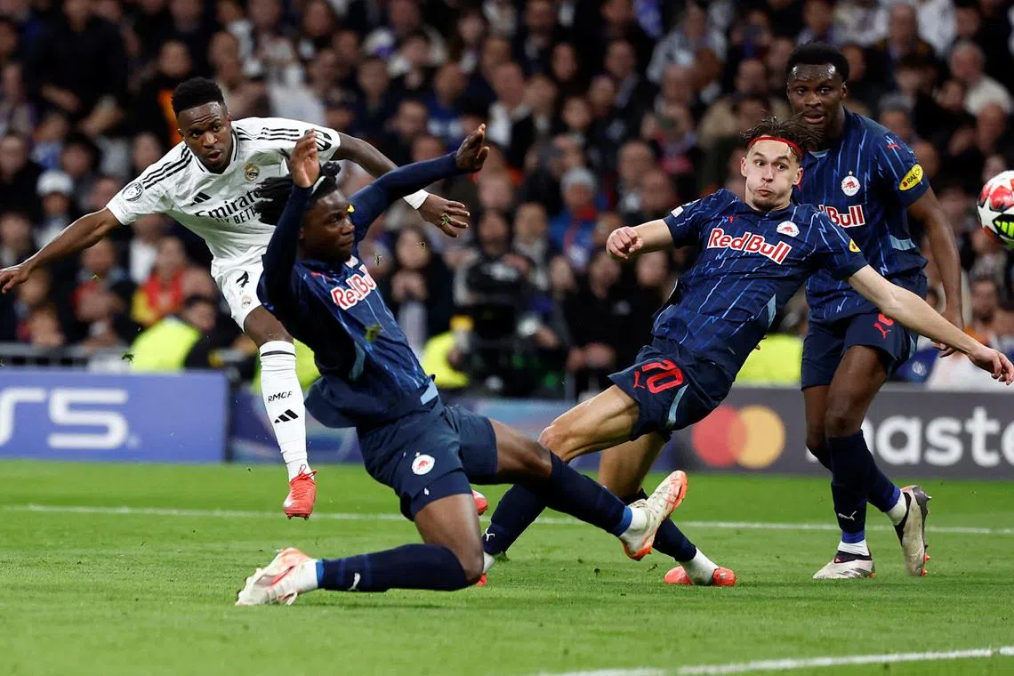 Soccer Football - Champions League - Real Madrid v FC Salzburg - Santiago Bernabeu, Madrid, Spain - January 22, 2025 Real Madrid's Vinicius Junior scores their fourth goal REUTERS/Juan Medina