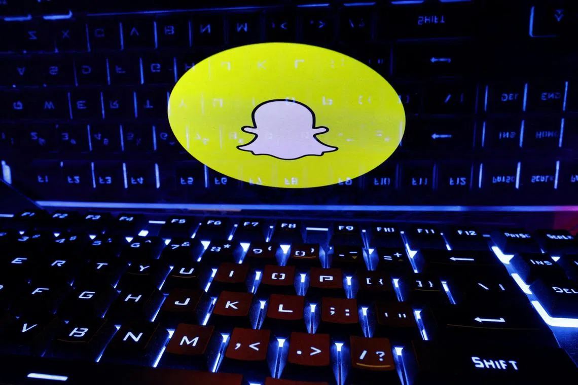 FILE PHOTO: A keyboard is placed in front of a displayed Snapchat logo in this illustration taken February 21, 2023. REUTERS/Dado Ruvic/Illustration/File Photo