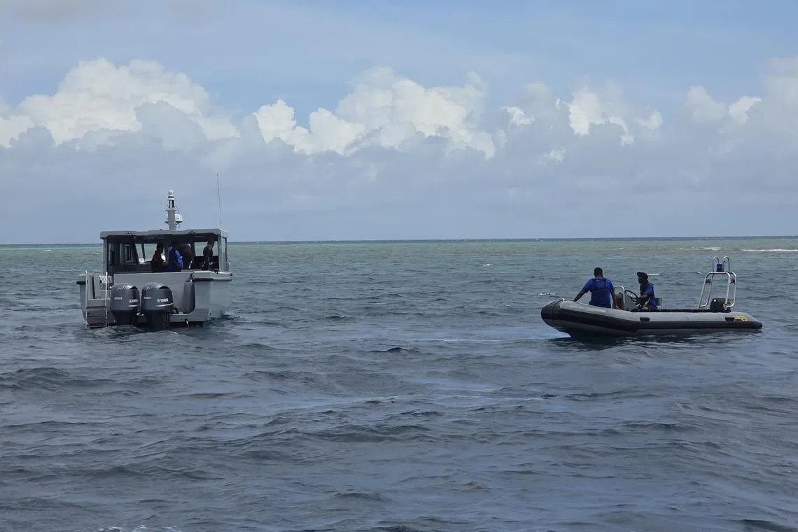 Divers conducting search and recovery operations for the bodies of four Italian divers in the waters of Vaavu Atoll, Maldives, on May 19.