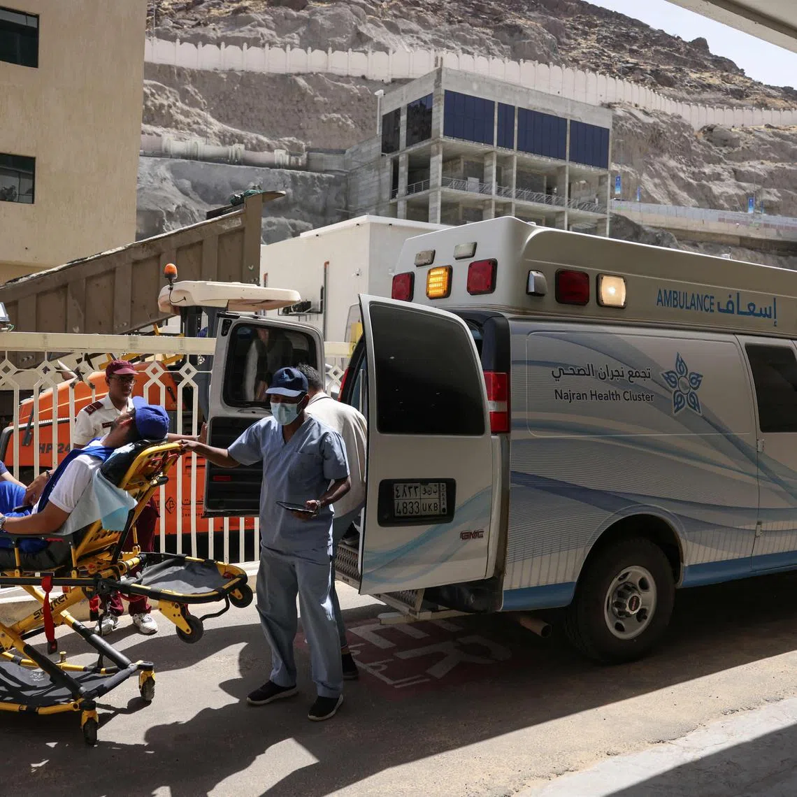 Medics transport a man suffering from heat stroke to a hospital in the holy city of Mecca.