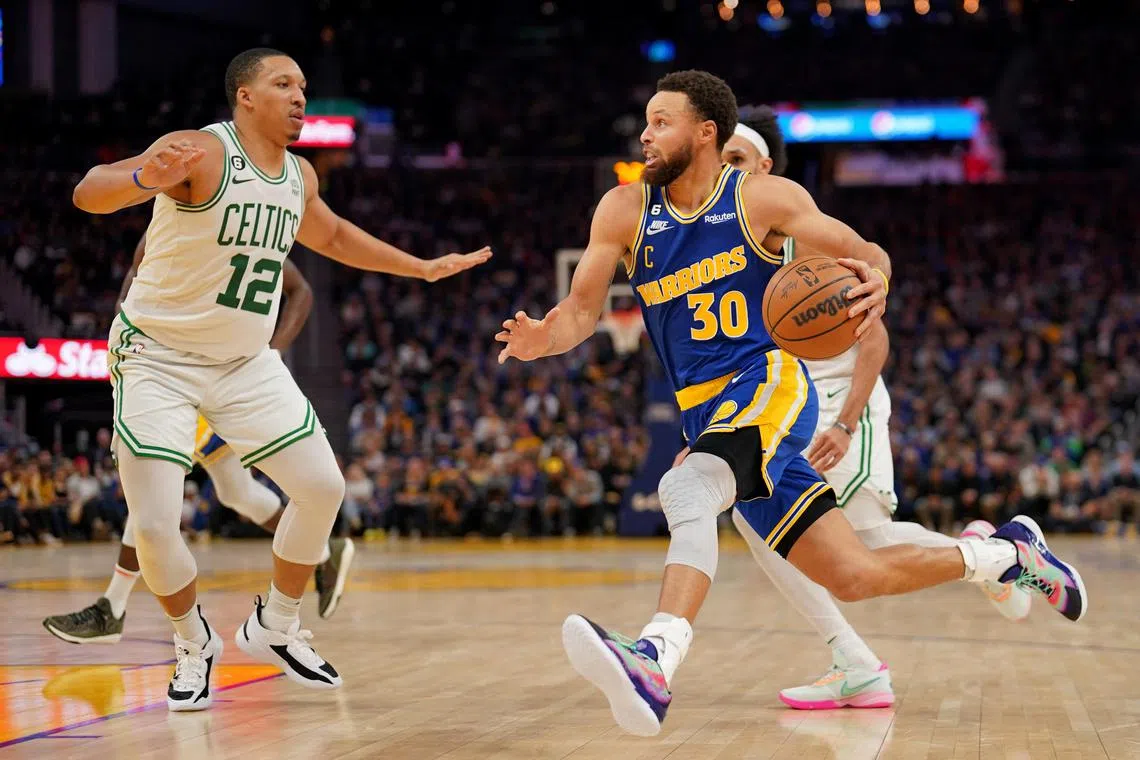 Dec 10, 2022; San Francisco, California, USA; Golden State Warriors guard Stephen Curry (30) dribbles the ball against Boston Celtics forward Grant Williams (12) in the fourth quarter at the Chase Center. Mandatory Credit: Cary Edmondson-USA TODAY Sports