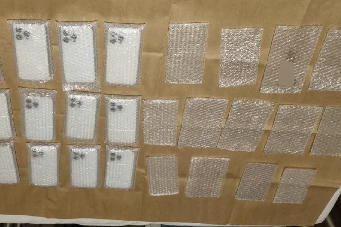 22 counterfeit mobile phones, charging cables, and cash amounting to more than $1,000 were seized.