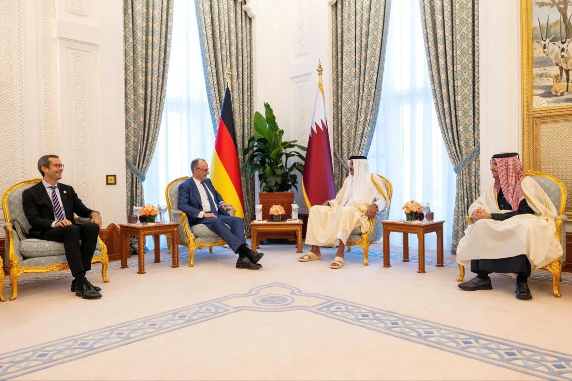 Qatar's Emir Sheikh Tamim bin Hamad Al Thani meets with German Chancellor Friedrich Merz, in Doha, Qatar, February 5, 2026. Amiri Diwan/Handout via REUTERS THIS IMAGE HAS BEEN SUPPLIED BY A THIRD PARTY