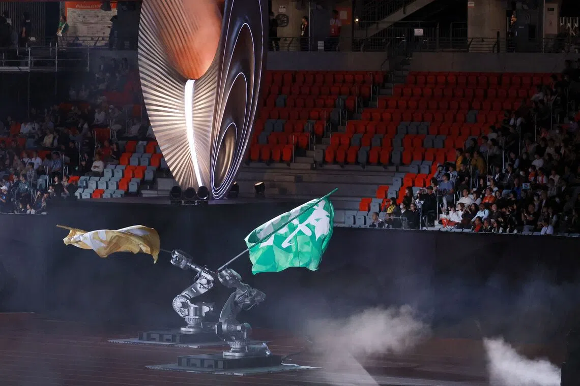 Robotic arms with flags at the closing ceremony of the 2026 Asian Games at Nagoya City Mizuho Park Athletic Stadium in Nagoya, on Oct 4.