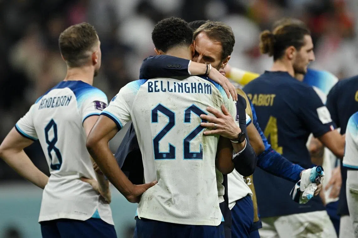 England manager Gareth Southgate consoling midfielder Jude Bellingham after the team was eliminated from the World Cup by France.