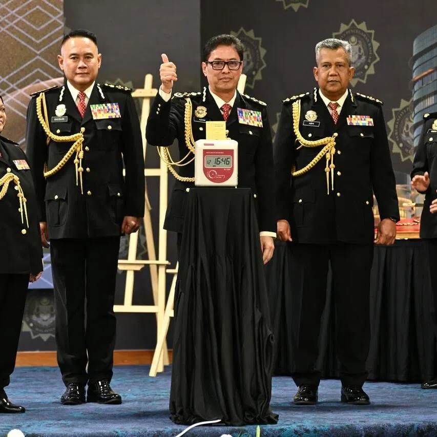 Tan Sri Azam Baki (middle) punches out for the last time, leaving the Malaysia Anti-Corruption Commission after his tenure was extended three times.