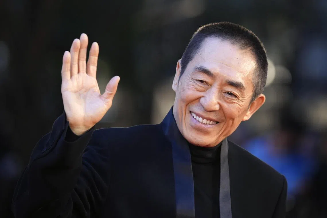 Chinese film director Zhang Yimou poses at the red carpet before receiving a lifetime achievement award during the opening ceremony of the 36th Tokyo International Film Festival (TIFF) in Tokyo, Japan, on Oct 23, 