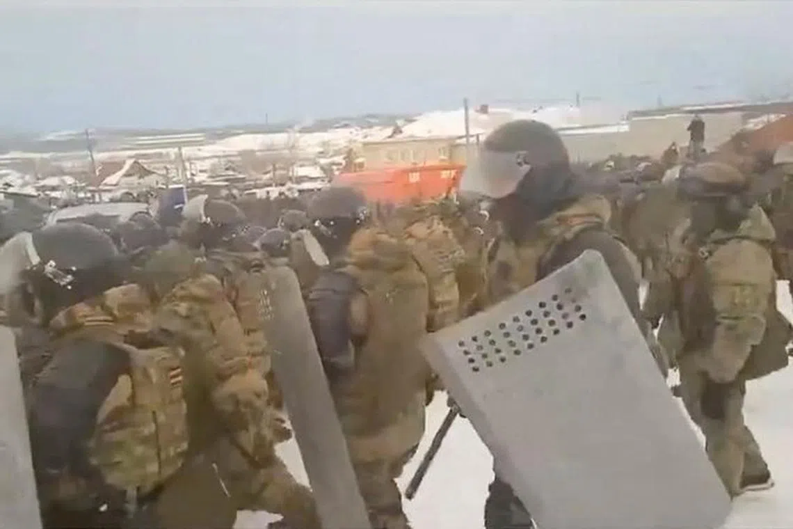 FILE PHOTO: Law enforcement officers disperse the crowd during a rally in support of activist Fail Alsynov, who was charged with inciting ethnic hatred and sentenced to four years in a prison colony, near a court building in Baymak in the Republic of Bashkortostan, Russia, in this still image from video published January 17, 2024. RusNews via REUTERS/File Photo