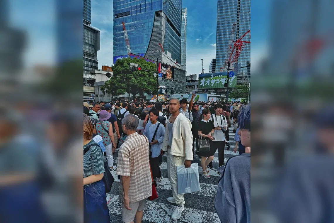 Kiss92 DJ Joshua Simon at the Shibuya Crossing in Tokyo.