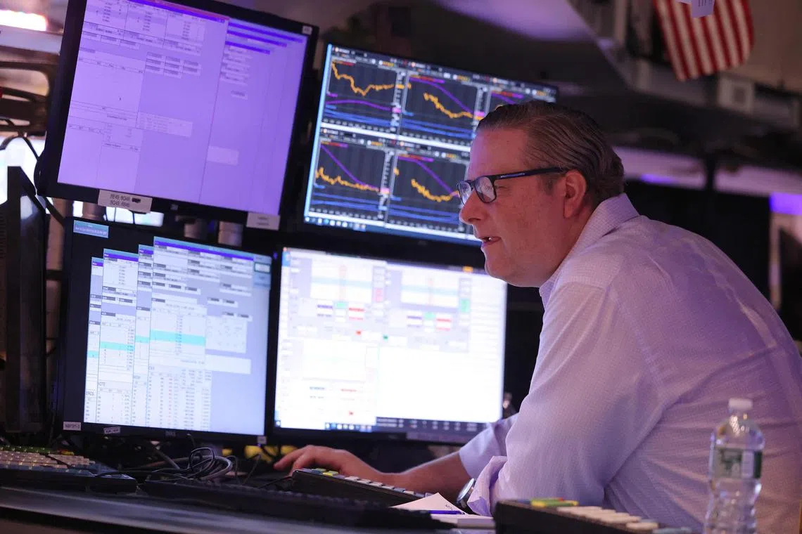 A trader works on the floor of the New York Stock Exchange, in New York City.