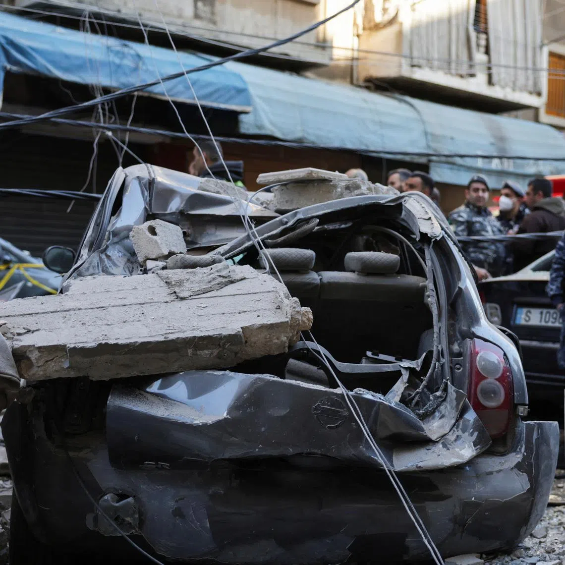 Debris lies on a damaged vehicle at site of an Israeli strike on an apartment building, in central Beirut, Lebanon, March 11, 2026, following an escalation between Hezbollah and Israel amid the U.S.-Israeli conflict with Iran. REUTERS/Emilie Madi