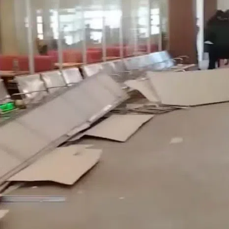 A portion of the ceiling fell onto the airport’s waiting chairs..