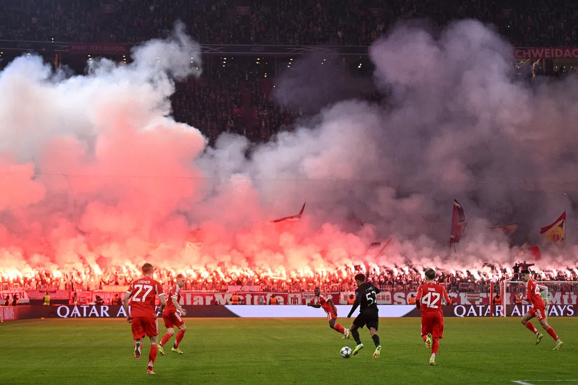 FILE PHOTO: Soccer Football - UEFA Champions League - Bayern Munich v Sporting CP - Allianz Arena, Munich, Germany - December 9, 2025 Sporting CP's Joao Simoes in action as Bayern Munich fans are seen with flares and banners in the stands REUTERS/Angelika Warmuth/File Photo