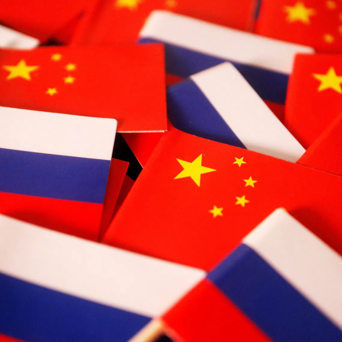 Flags of China and Russia are displayed in this illustration picture taken March 24, 2022. REUTERS/Florence Lo/Illustration