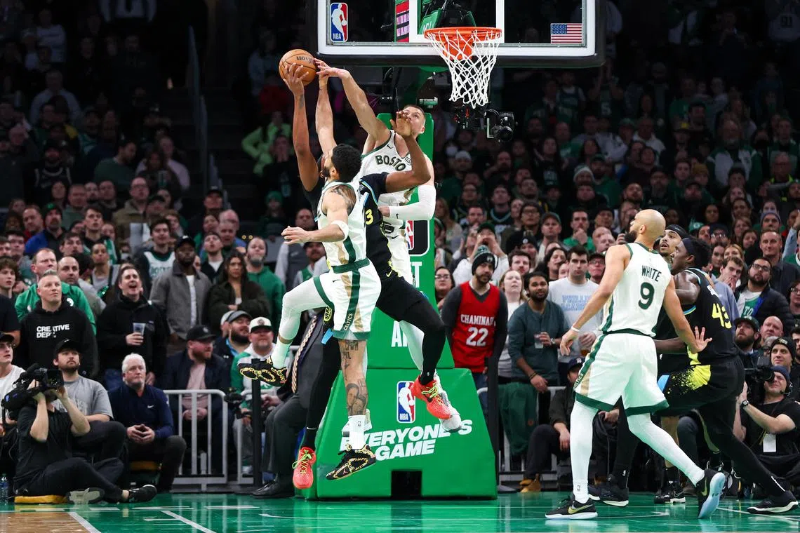 Boston Celtics forward Jayson Tatum and centre Kristaps Porzingis block Indiana Pacers centre Myles Turner in a strong defensive display during the second half at TD Garden. 