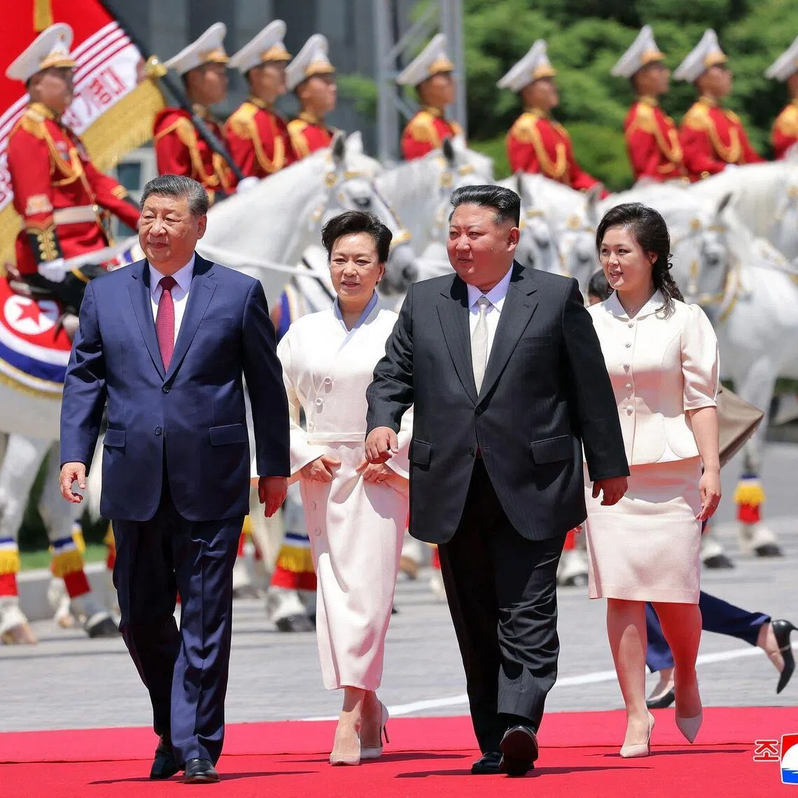 (From left) Chinese President Xi Jinping, his wife Peng Liyuan, North Korean leader Kim Jong Un and his wife Ri Sol Ju at a welcome ceremony for Xi in Pyongyang on June 8.