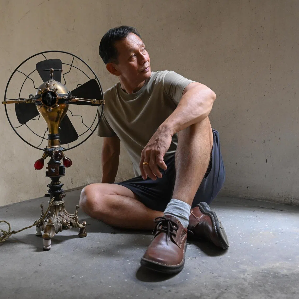 ST20250123_202511100466/htfan/Shintaro Tay/ Toh Chee Keong or CK with a functional direct current Victorian fan, which intended as a gift for Thomas Edison, the inventor of the modern light bulb at Tong Lee Building on Jan 23, 2025. Adorned with miniature replicas of Edison's inventions, the fan was more than a relic of the electrical age, it was also a gateway to the many stories and adventures that would shape CK's life as a collector for the next half a century.