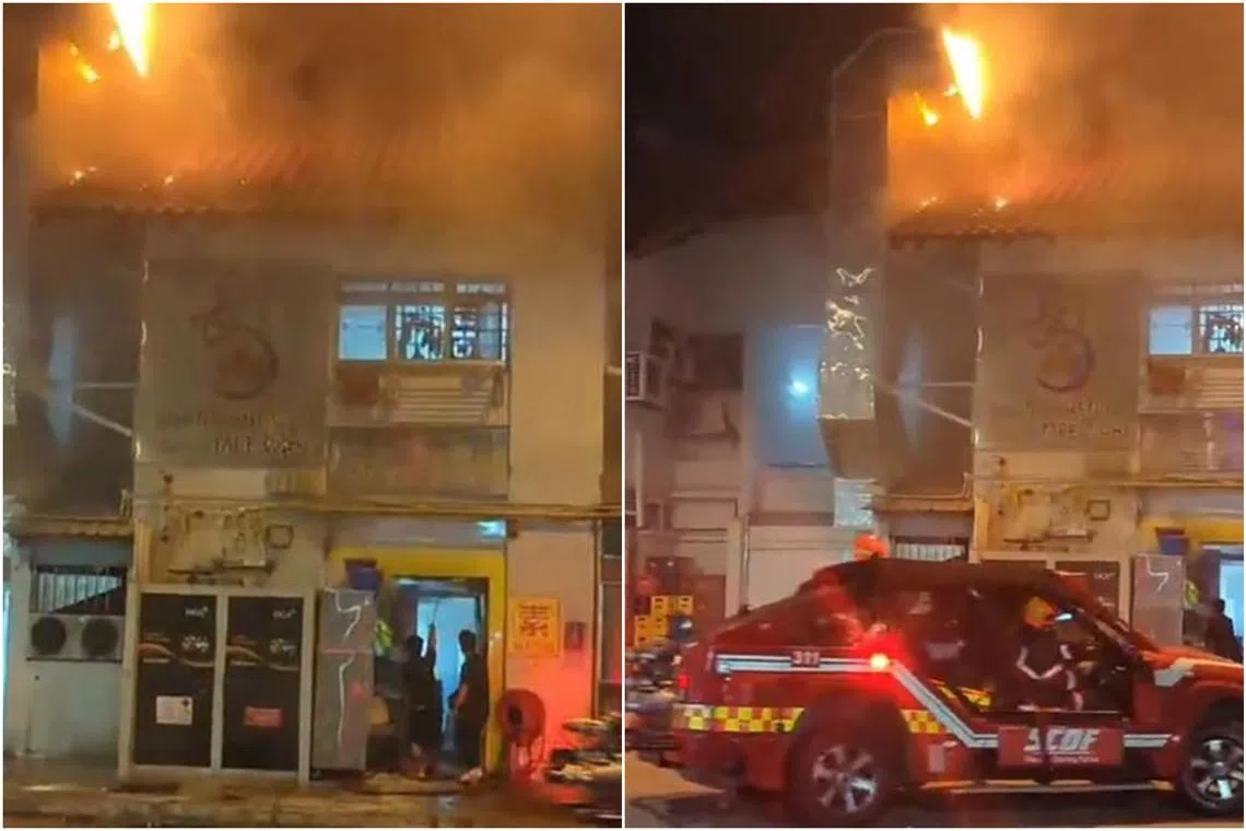 A video showed bright orange flames on top of a two-storey building, before firefighters arrived to put out the fire.
