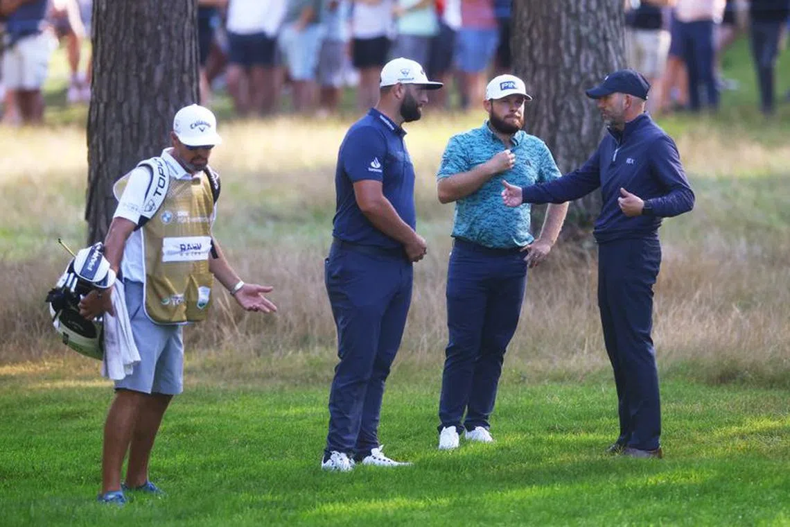 FILE PHOTO: Golf - European Tour - BMW PGA Championship - Wentworth, Virginia Water, Britain - September 15, 2023 Spain's Jon Rahm and England's Tyrrell Hatton talk to a course referee during second round Action Images via Reuters/Paul Childs/File Photo