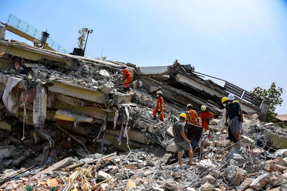 Rescue workers continue a search operation at the site of a collapsed building in Mandalay, Myanmar, on March 31.