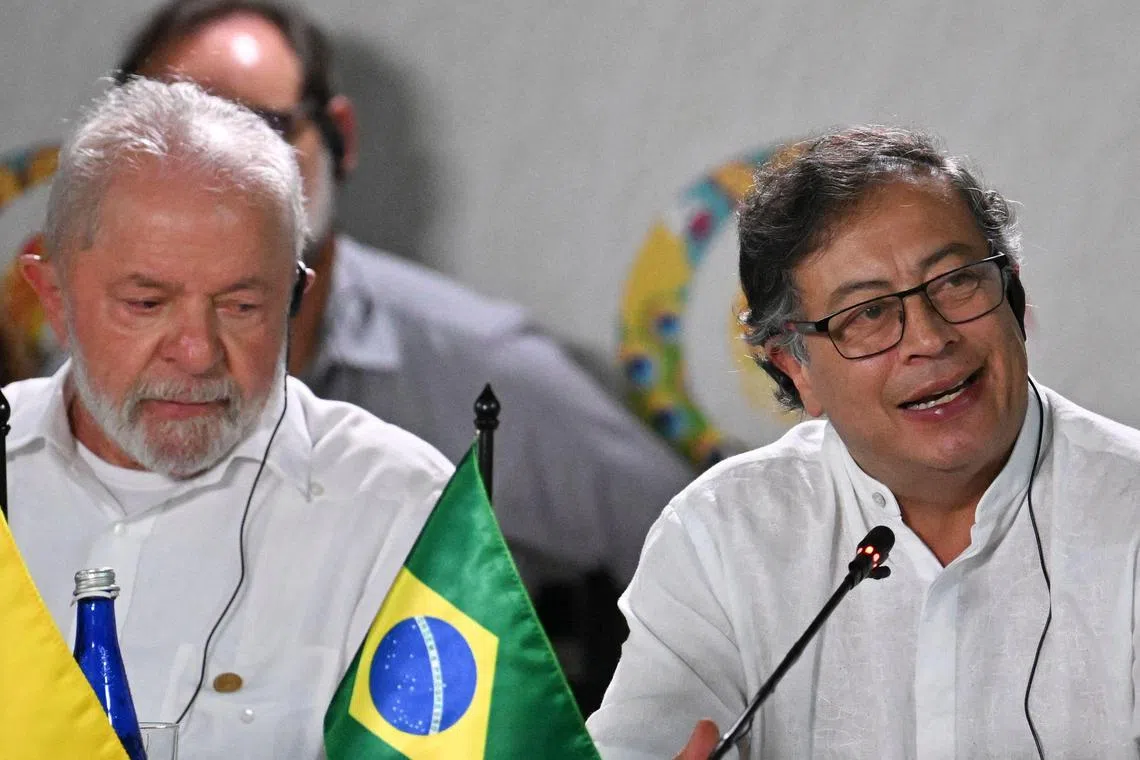 Brazilian President Luiz Inacio Lula da Silva (left) listens as Colombian President Gustavo Petro speaks during the talks.