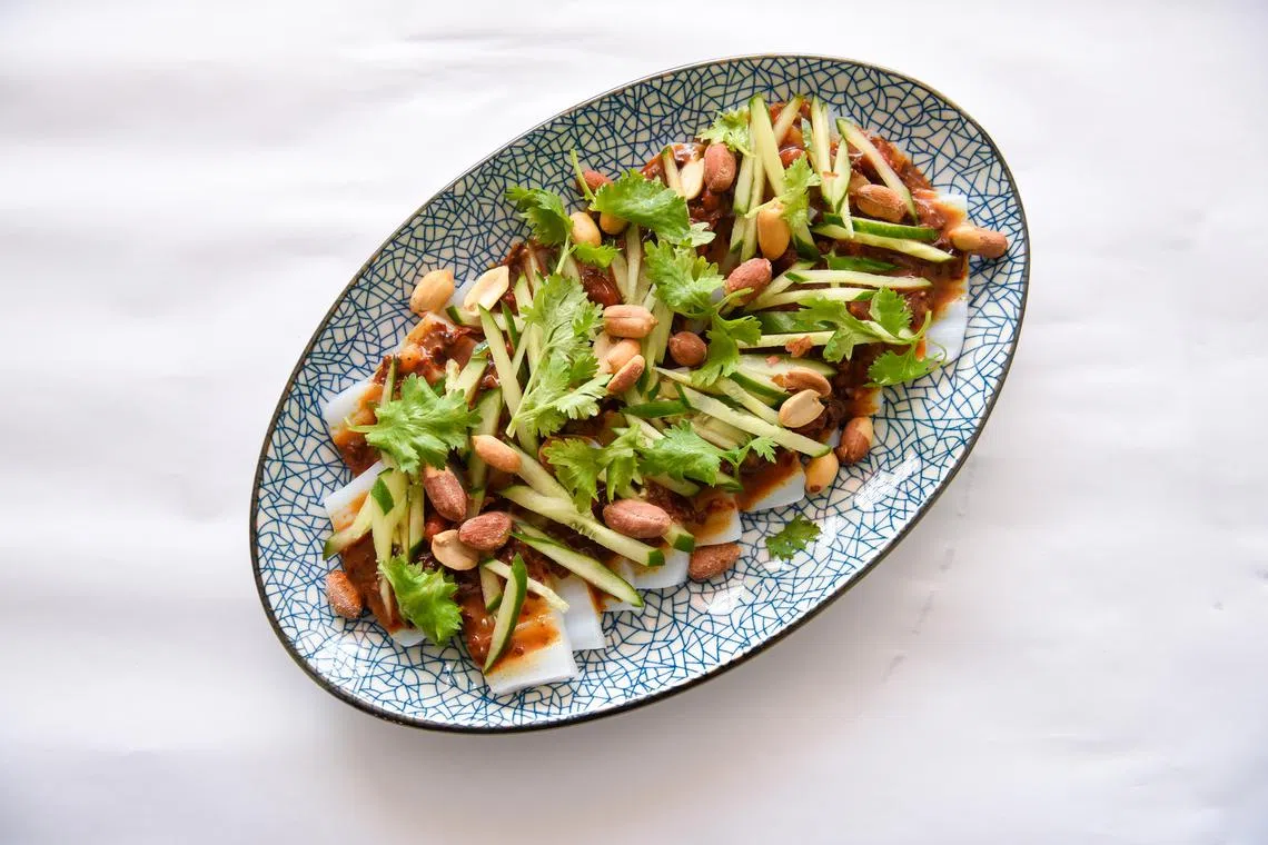 ST20230529_202319151357-Eugene Tan-Tan Hsueh Yun-hydrink03/ 

Monk Bean Starch Noodles (Liang Fen) with sesame sauce and topped with cucumber, coriander and peanuts on May 29, 2023./ 

(ST PHOTO: EUGENE TAN)