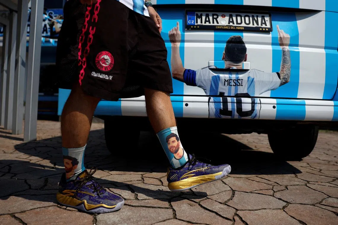 Miloslav \"Curby\" Urbanec, a 51-year-old Czech national and an ardent Argentine football fan, wears Lionel Messi themed socks as he walks past his car in front of of his house, in the village of Bukovka near the town of Lazne Bohdanec, Czech Republic, June 29, 2026. REUTERS/David W Cerny
