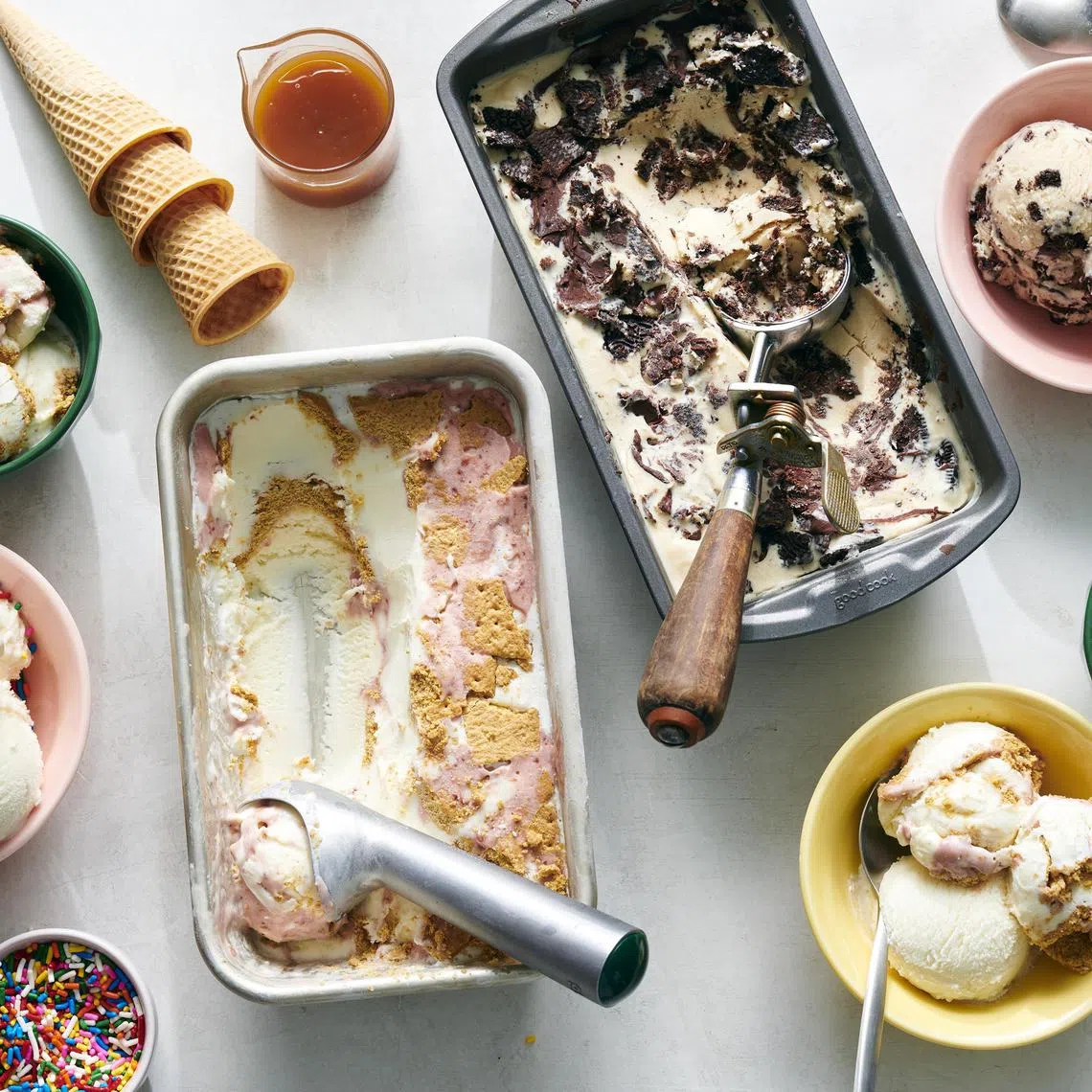 Strawberry cheesecake ice cream and peanut butter pie ice cream. The best ice cream this summer is the one you create. Food styled by Barrett Washburne. (David Malosh/The New York Times)