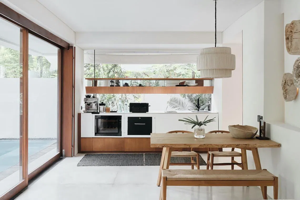 The one-room villa includes a kitchenette (pictured), a wine fridge and even a powder room. 