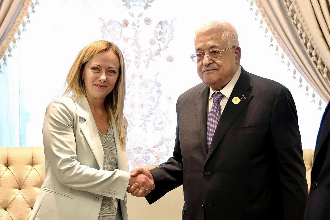 Italian PM Giorgia Meloni (left) meeting Palestinian President Mahmoud Abbas in Cairo on Oct 21.