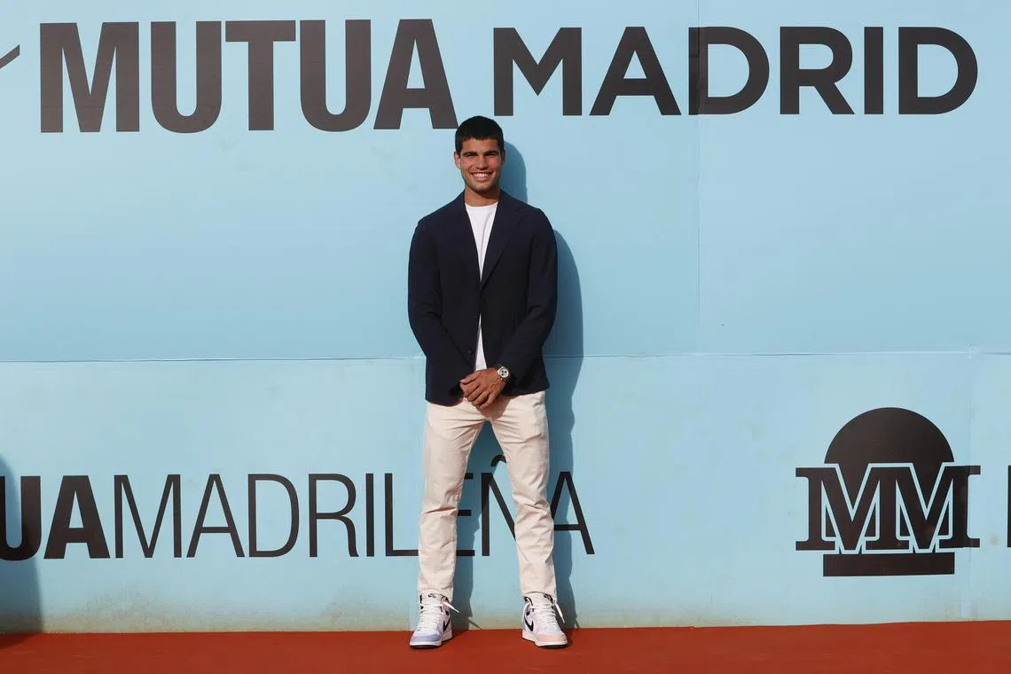 Spanish tennis star Carlos Alcaraz poses for photographers during the  official presentation of the Madrid Open.