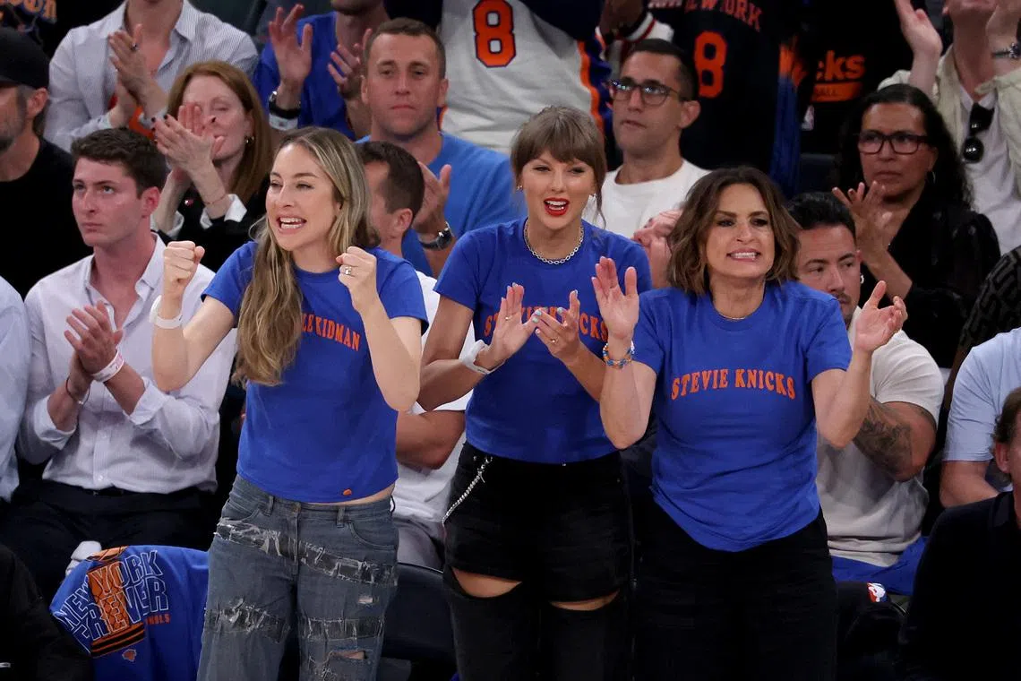 Singer Taylor Swift (centre) and musicians Alana and Este Haim attends Game Three between the New York Knicks and the Cleveland Cavaliers in the NBA Eastern Conference Finals at Rocket Arena on May 23.